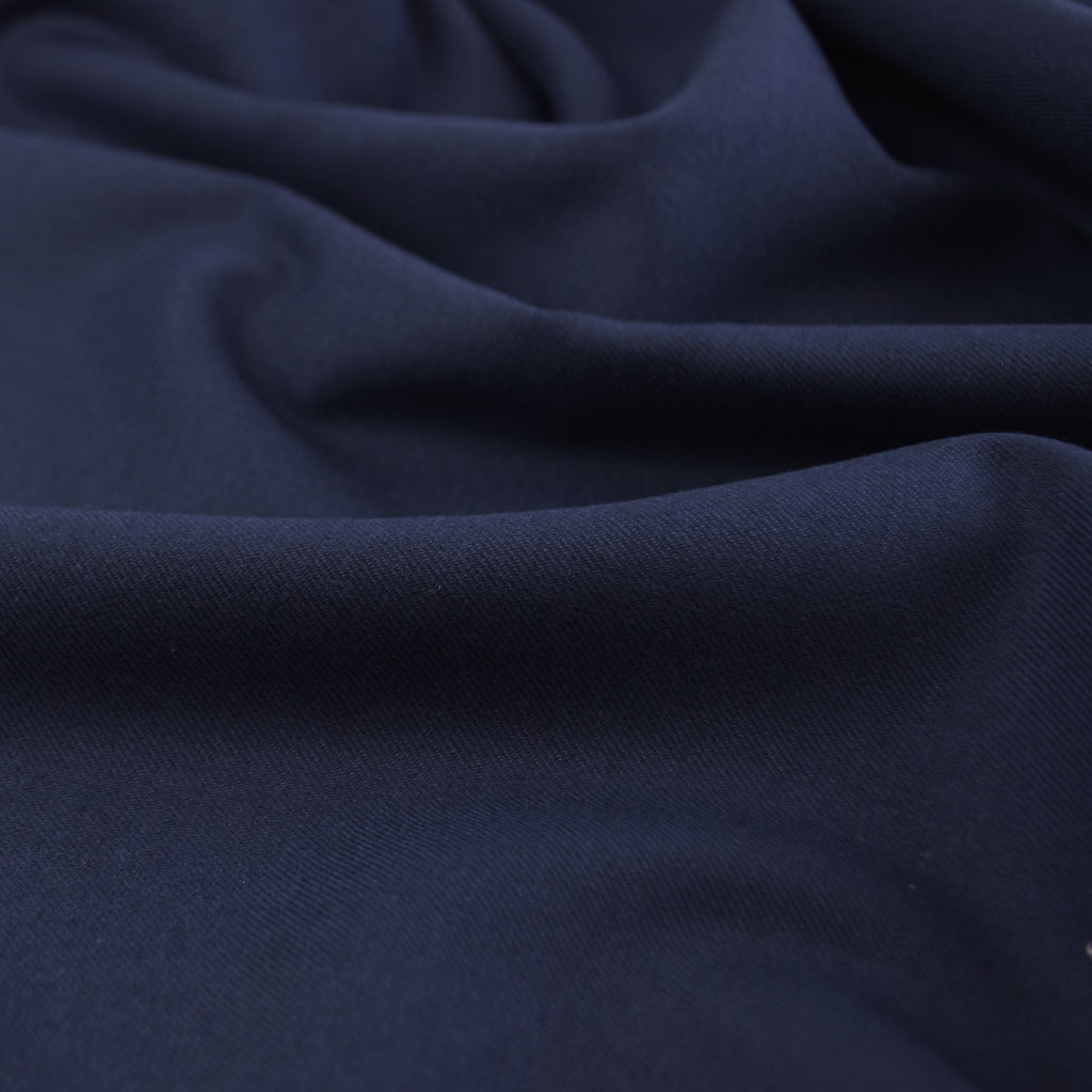 Navy Crease-resistant Bamboo Twill Fabric draped over table