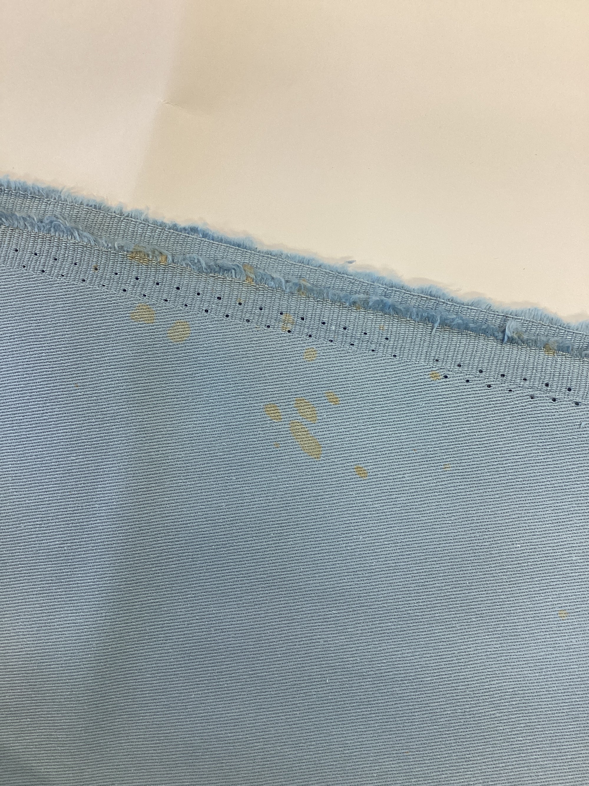 Stretch Cotton Drill - Sky Blue with diffuse orange dye splatters